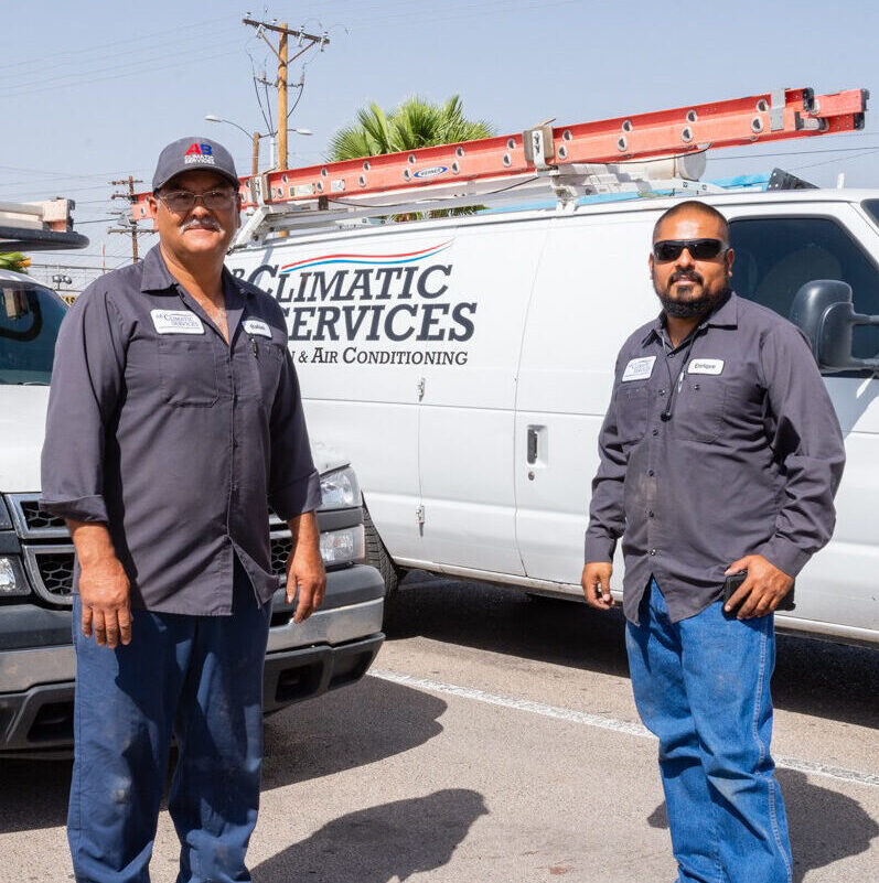 Professional AC services team members in action